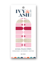 pink nail polish with hearts strips