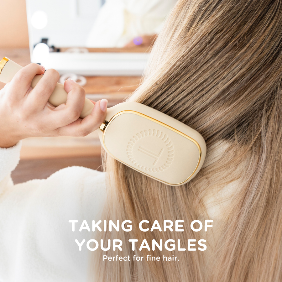 Person using a hairbrush on their hair with text 'Taking care of your tangles' and 'Perfect for fine hair.'