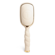 Beige paddle hairbrush with gold accents 