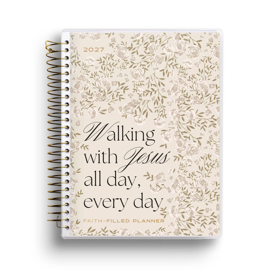Planner with floral design and text 'Walking with Jesus all day, every day' on a white background