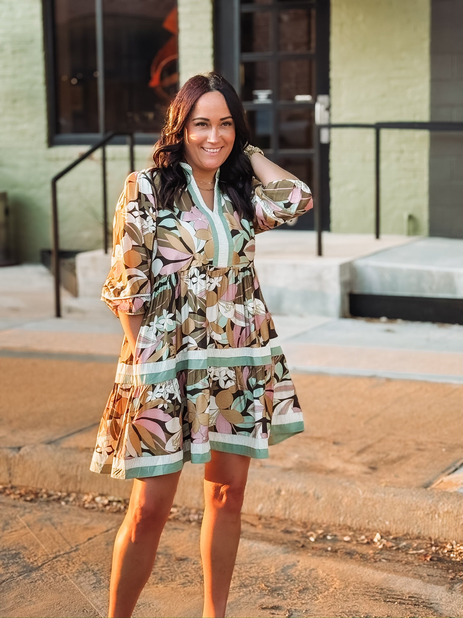 3/4's sleeve elastic cuff tiered mini dress with light floral detailing and contrast tiers.