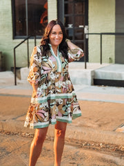 3/4's sleeve elastic cuff tiered mini dress with light floral detailing and contrast tiers.
