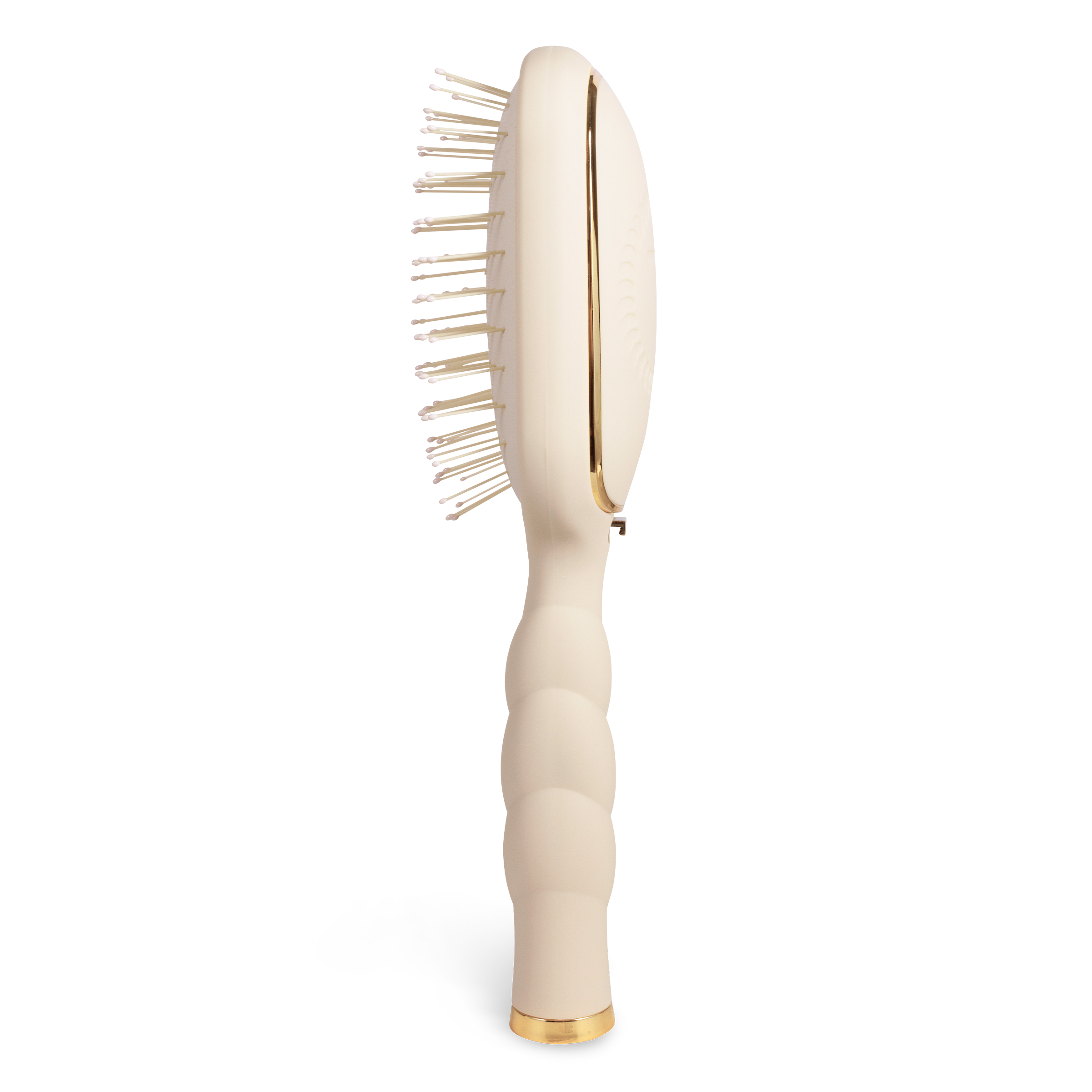 Beige paddle hairbrush with gold accents 