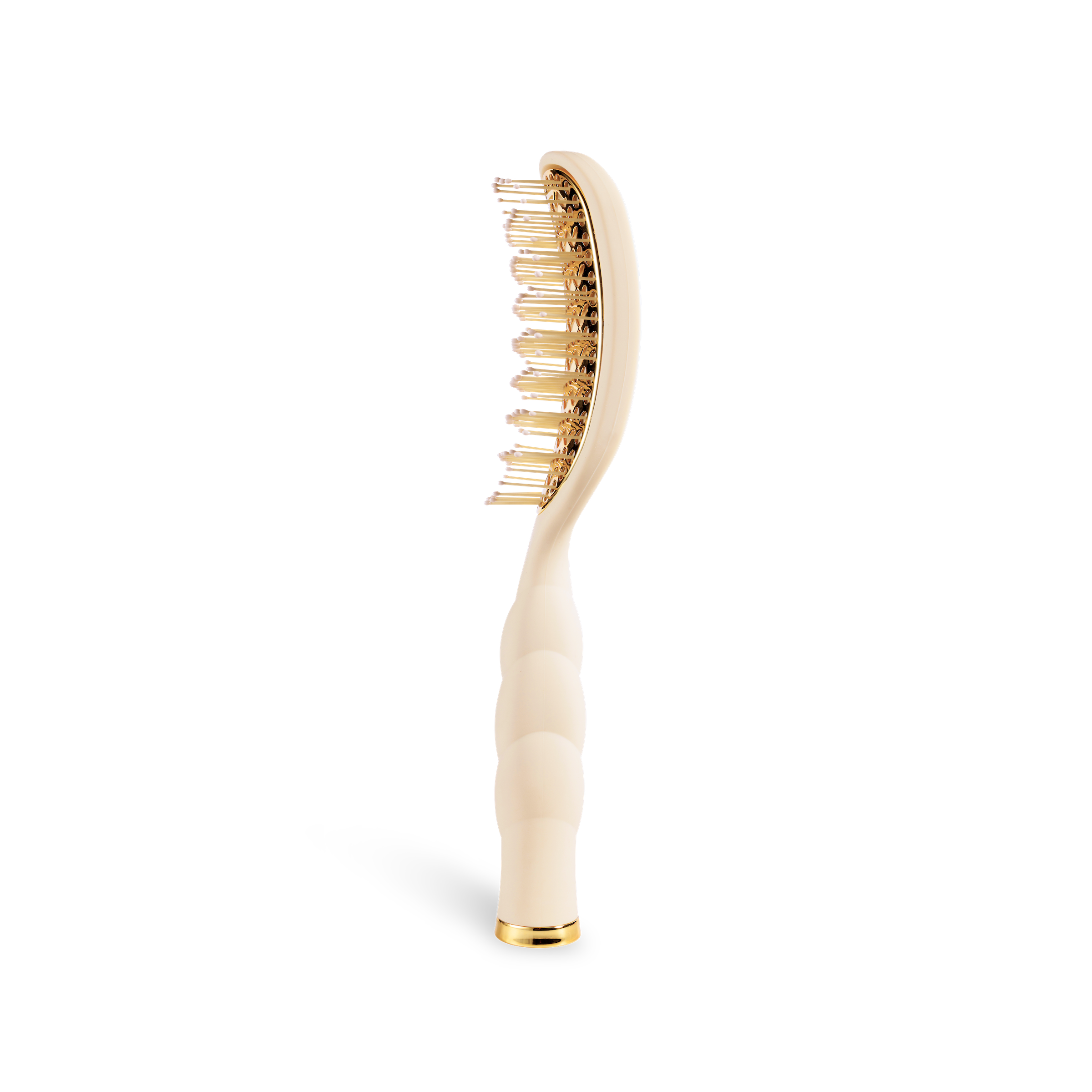 Hairbrush with gold bristles and tan handle