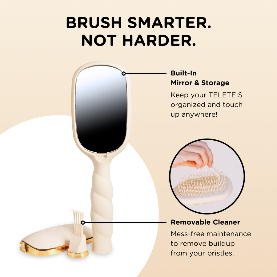 Beige paddle hairbrush with gold accents 