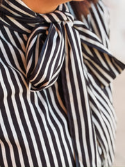 Black and white striped tie neck blouse with buttons 