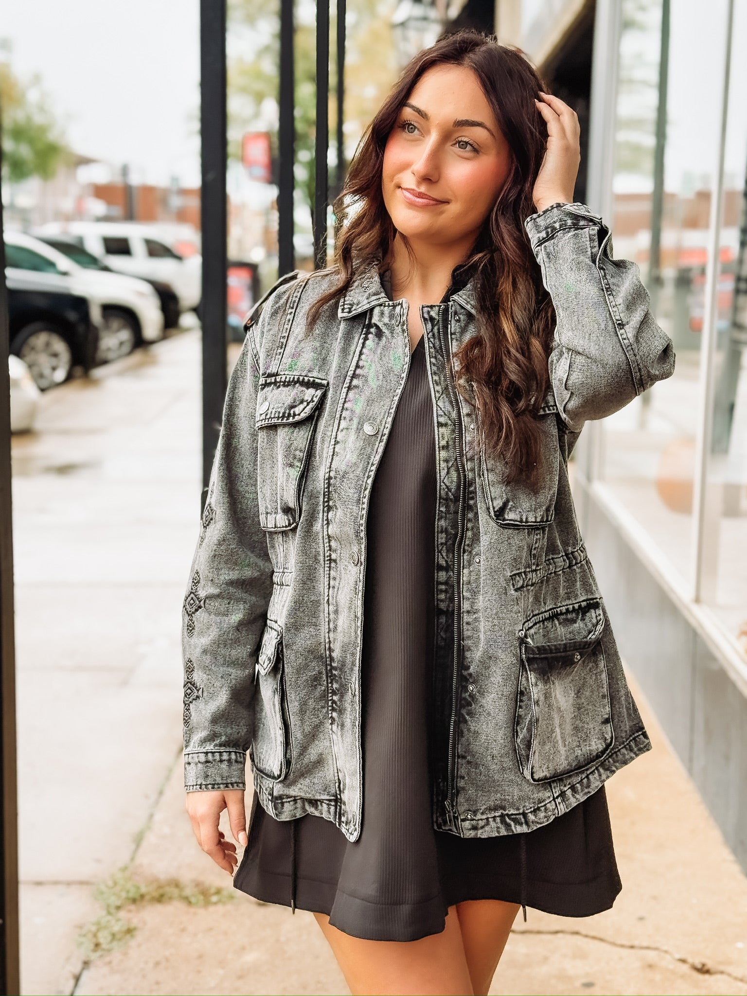 Black washed denim  anorak jacket with aztec print, a zipper and snap button front.