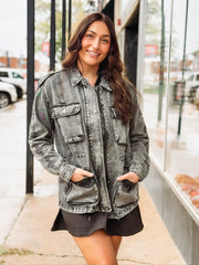 Black washed denim  anorak jacket with aztec print, a zipper and snap button front.