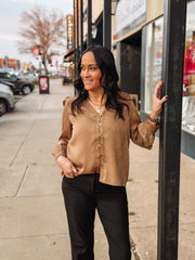 Bronze spotted long sleeve blouse with pleated detailing.