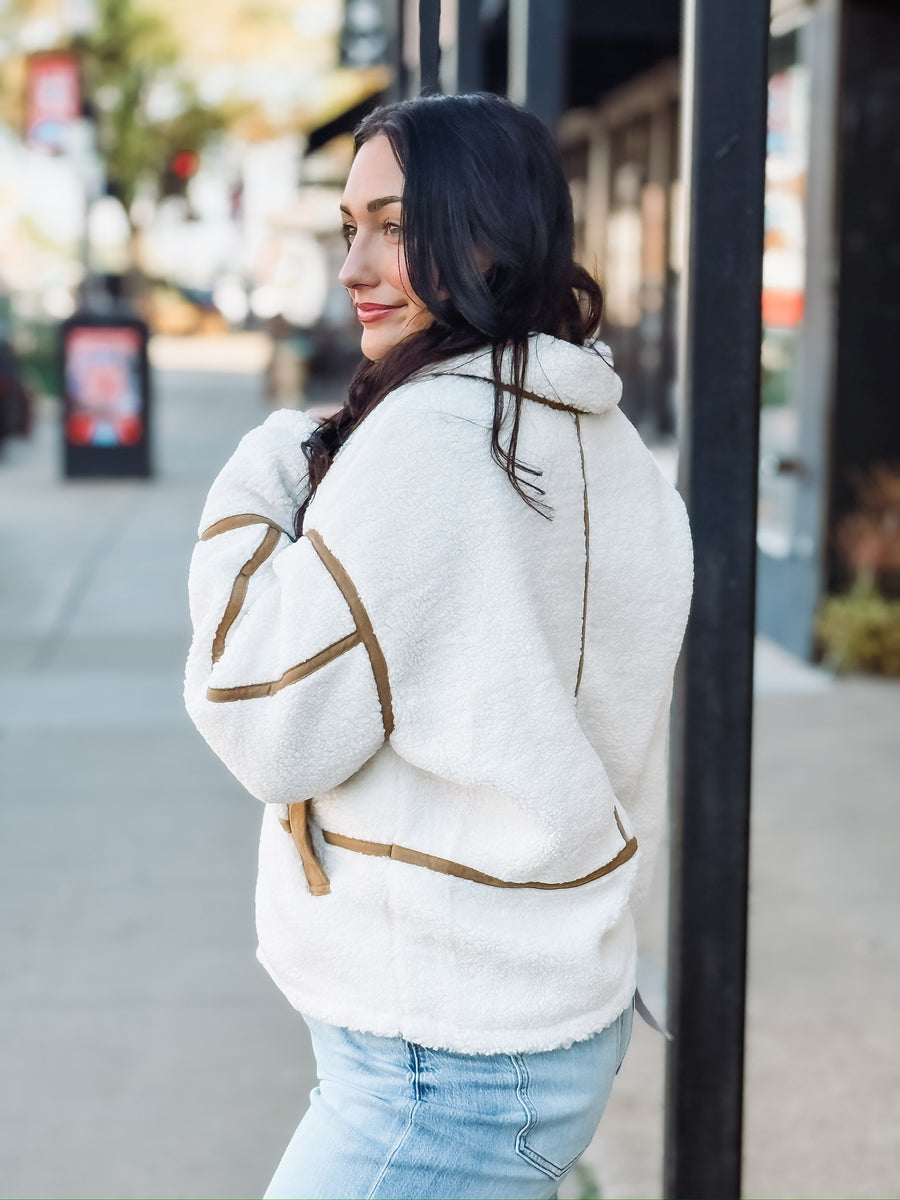 Brown suede contrast seamed sherpa jacket with zipper.