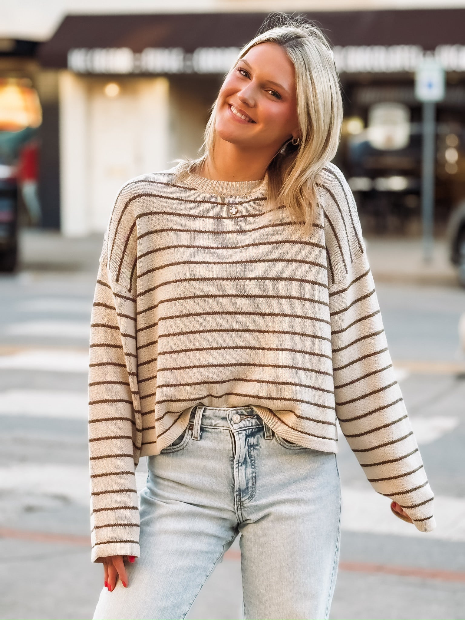 Brown and cream striped long sleeve sweater.