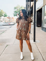Brown floral button up mini dress dress with high ruffled neckline and puff short sleeves.