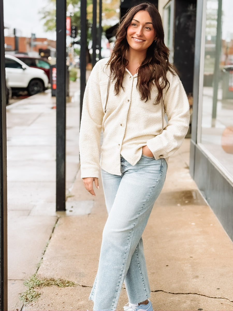 Cream long sleeve button up sherpa with detachable hood.