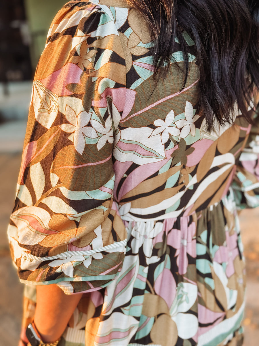 3/4's sleeve elastic cuff tiered mini dress with light floral detailing and contrast tiers.