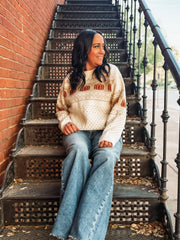 Long sleeve fairisle pumpkin detail sweater on an ivory base and cream and orange detail. 