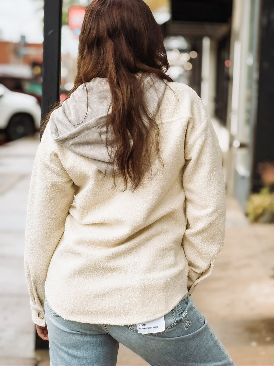 Cream long sleeve button up sherpa with detachable hood.