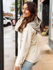 Cream long sleeve button up sherpa with detachable hood.
