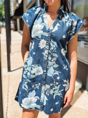 Denim button-up dress with a blue floral print, featuring short flutter sleeves and a flattering, slightly structured silhouette.