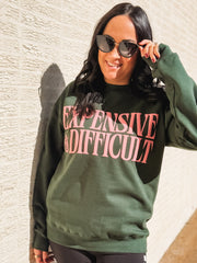 Expensive and Difficult printed on a green gildan crewneck.