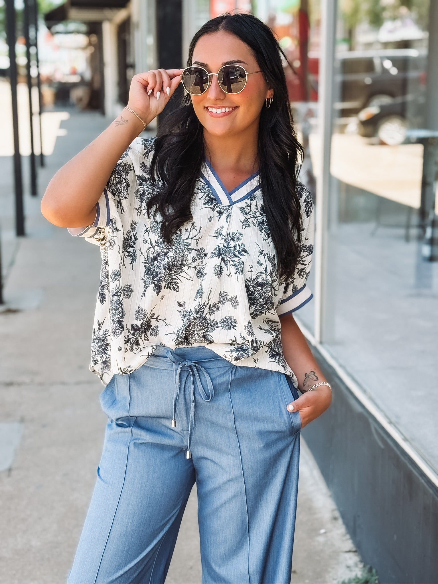 blue V-neck floral blouse in a relaxed fit with short sleeves