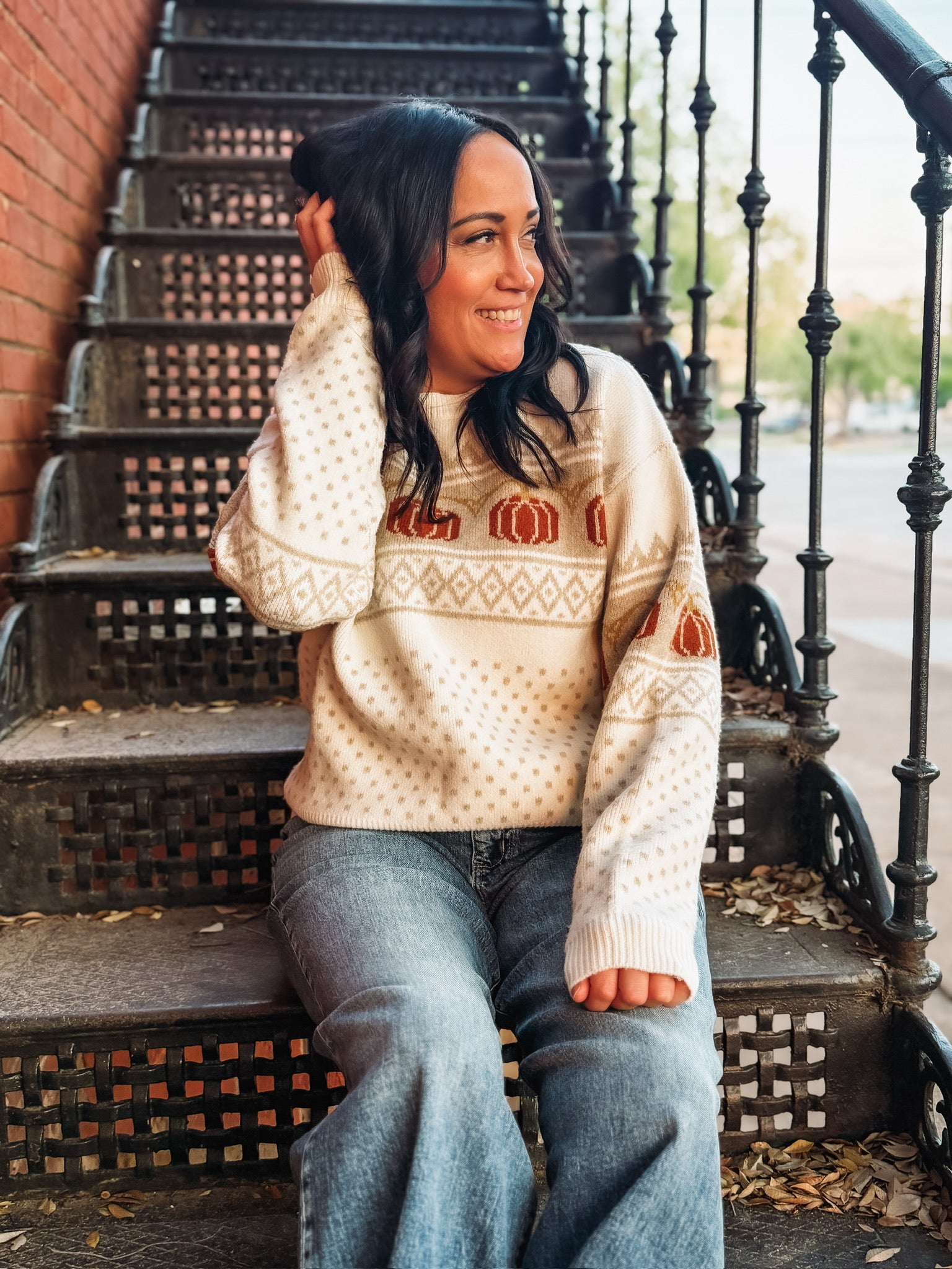 Long sleeve fairisle pumpkin detail sweater on an ivory base and cream and orange detail. 