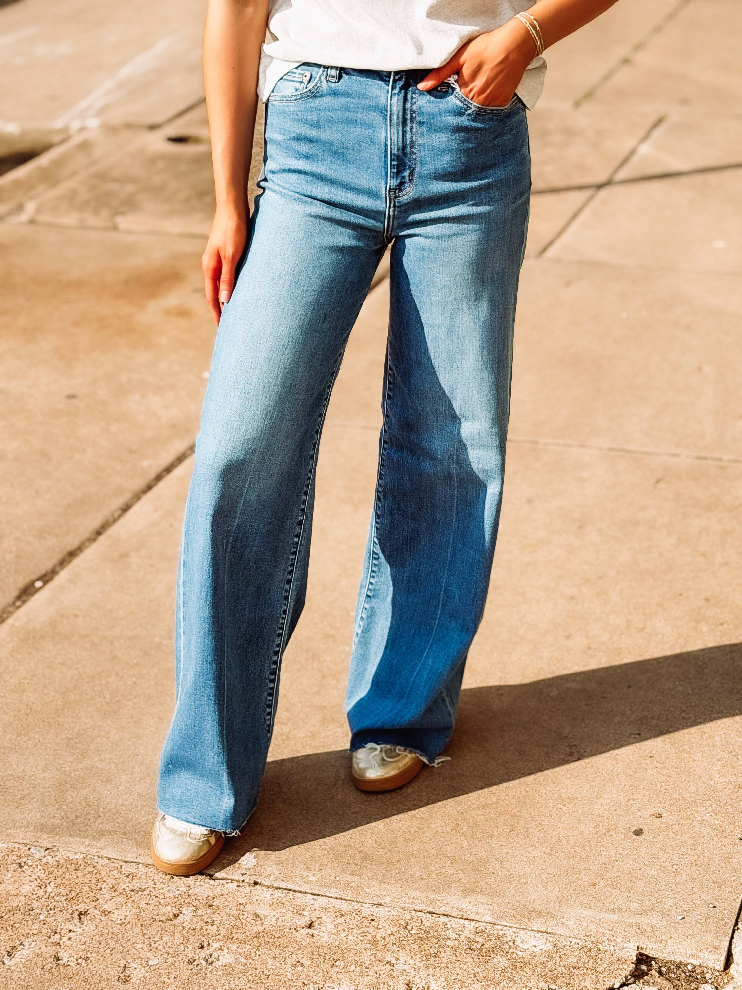 High rise medium wash straight leg jeans by Daze.