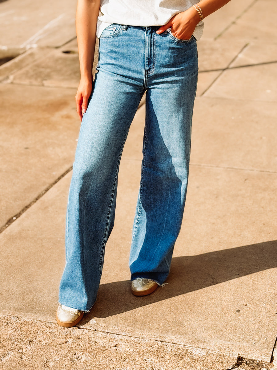 High rise medium wash straight leg jeans by Daze.