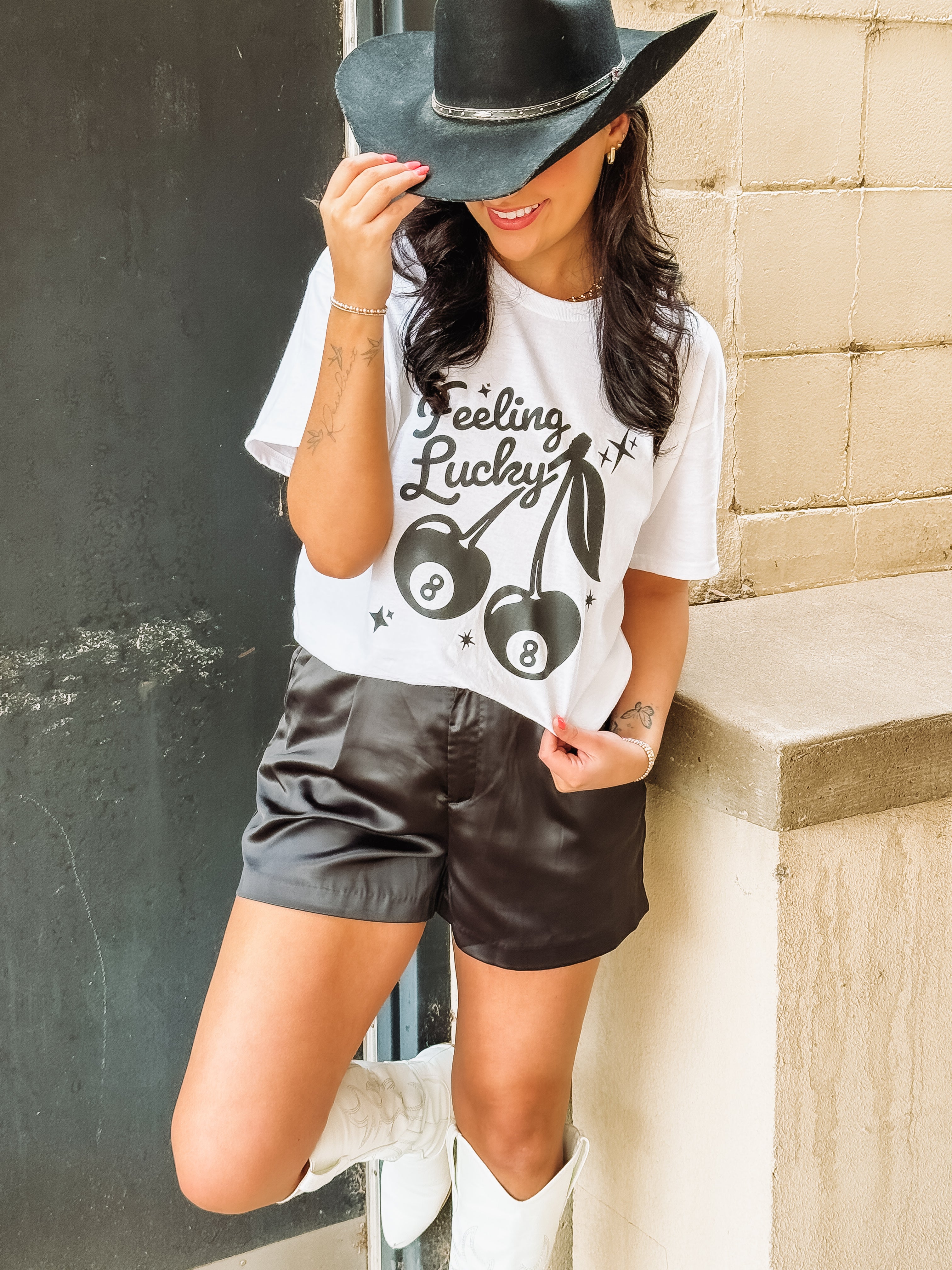 White tee with 8 ball graphic and 'feeling lucky' typography