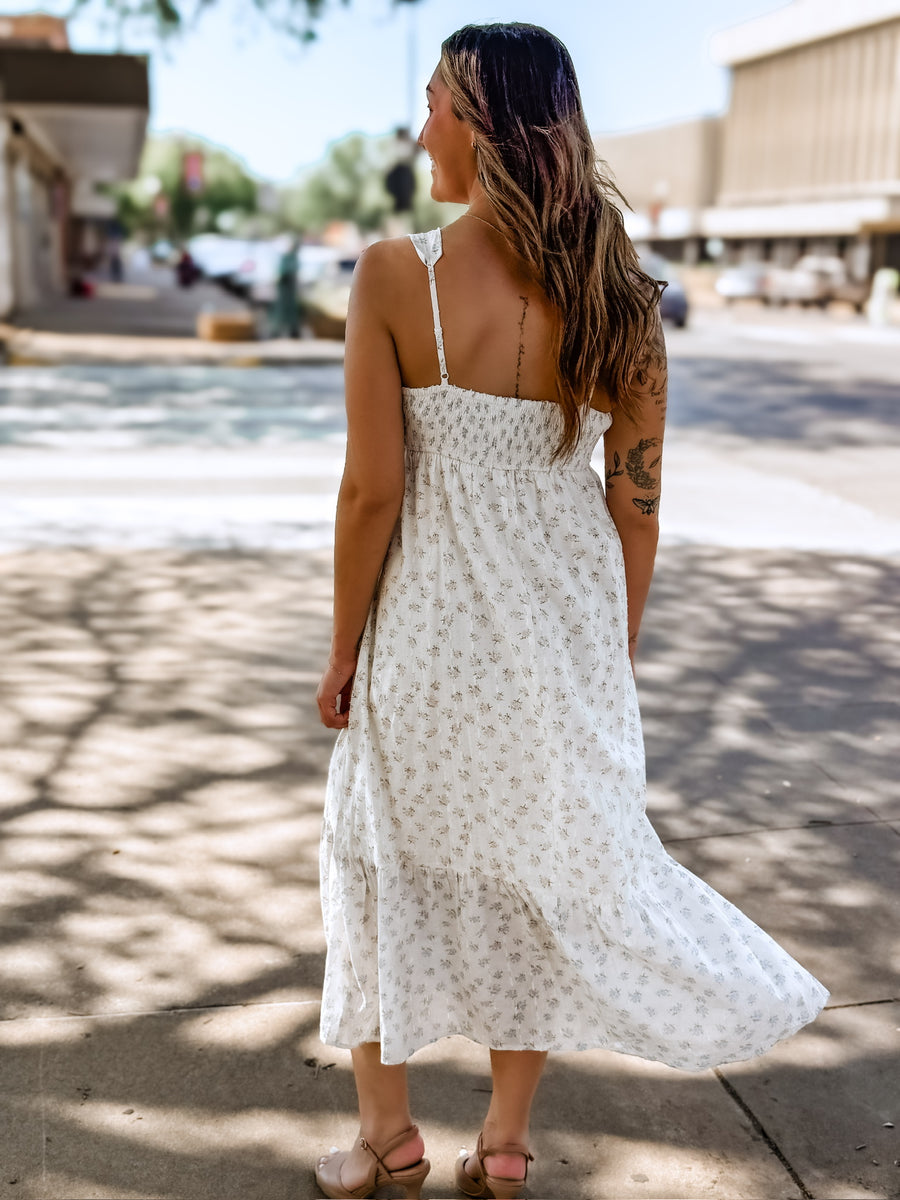 Blue and pink dainty floral maxi dress with adjustable spaghetti straps and a full button up front. 