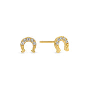 Gold pave horseshoe-shaped earrings with embedded stones on a white background