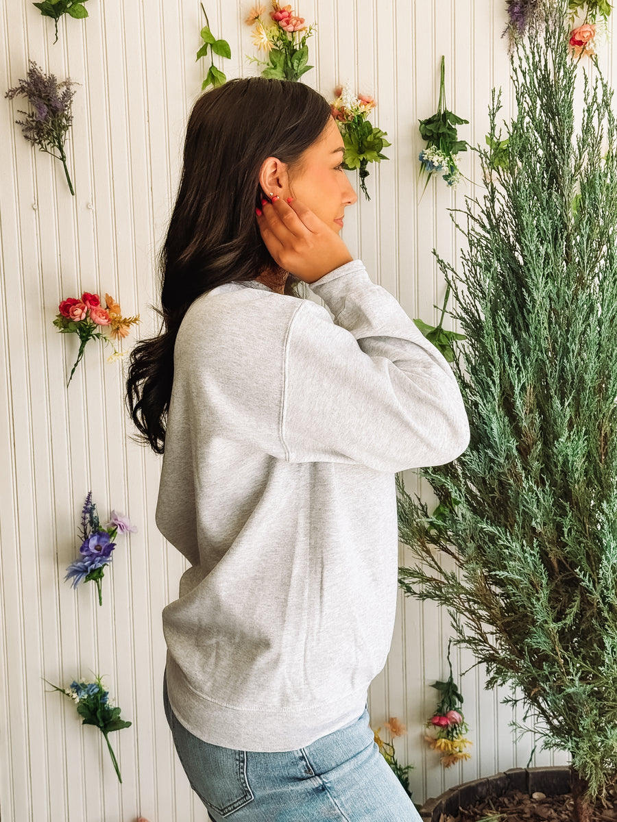 Washed gray crewneck sweatshirt with "Le Rodeo" typography