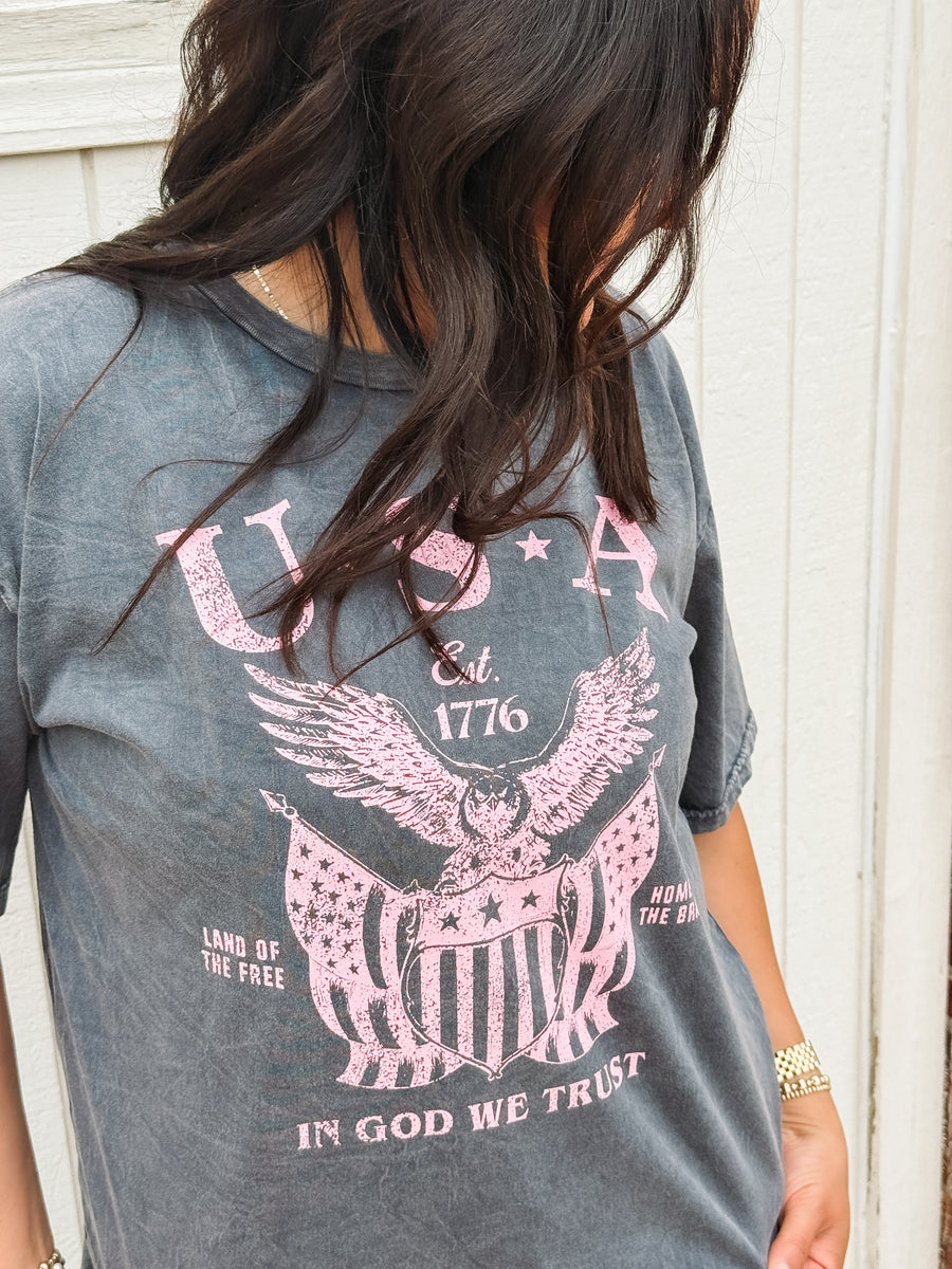 Gray graphic tee with pink 'USA' typography