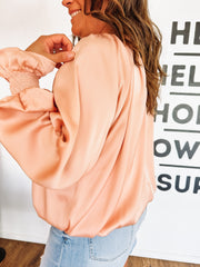 peach colored blouse