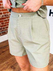 Sage green button up vest and short set.