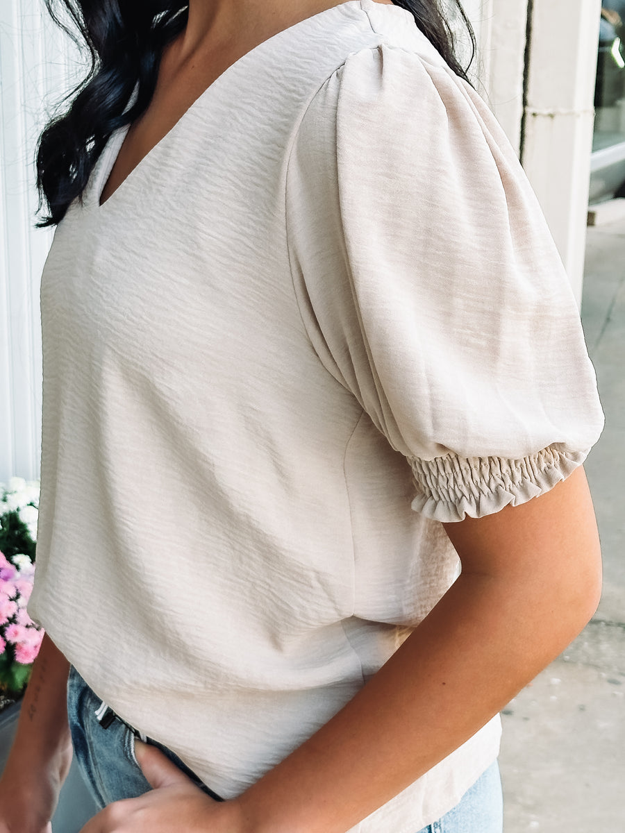 short sleeve cream colored textured blouse