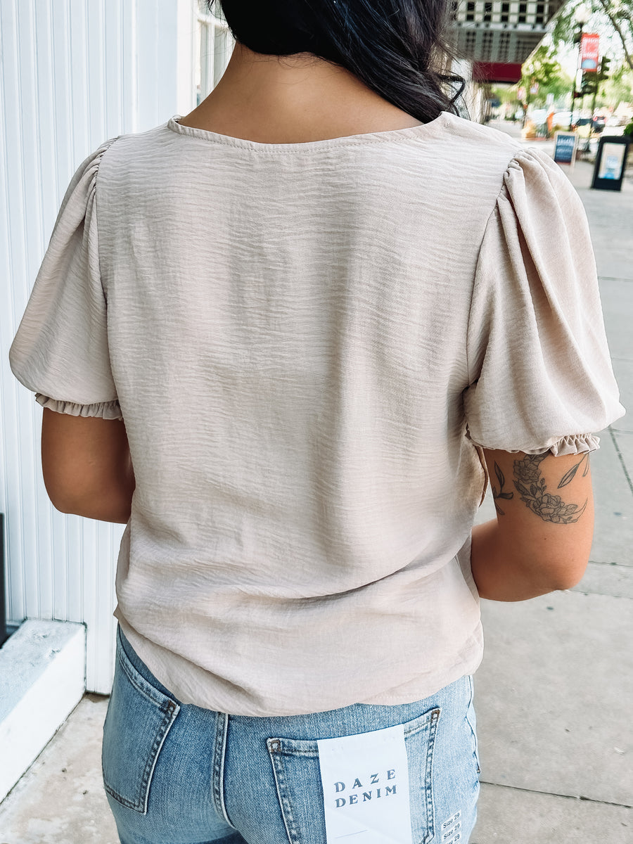 short sleeve cream colored textured blouse
