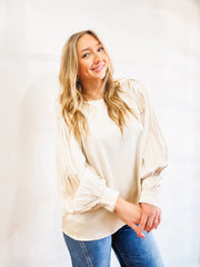 Champagne colored pleated long cuff sleeve blouse