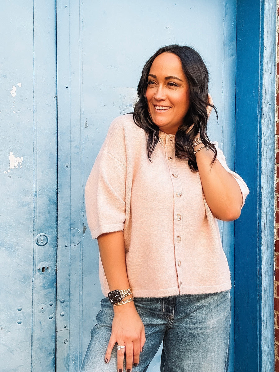 Light pink soft short Drop sleeve button up cardigan with large tortoise shell buttons.