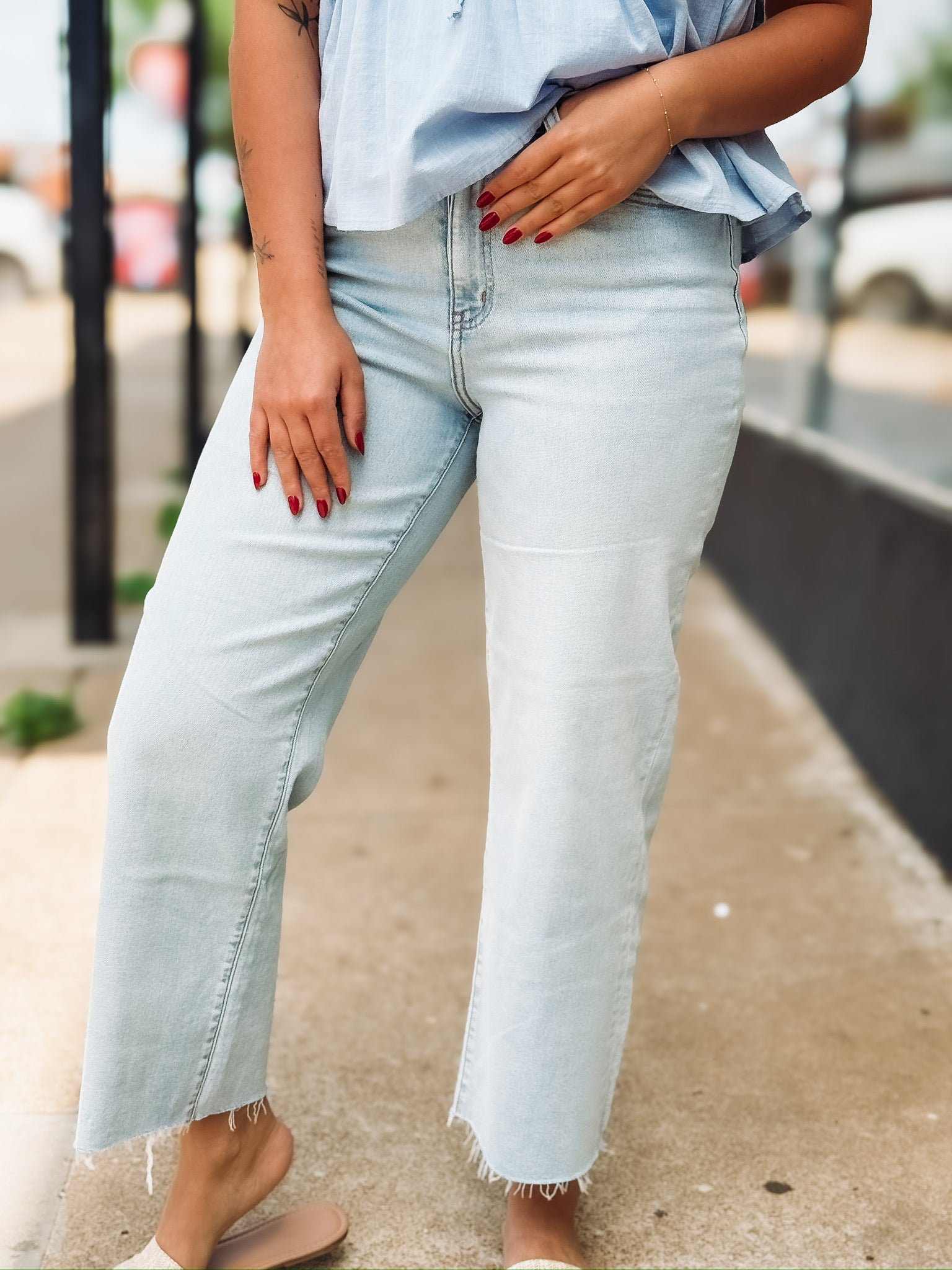 Light wash raw hem wide leg cropped jean. 