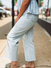 Light wash raw hem wide leg cropped jean by Daze Denim.