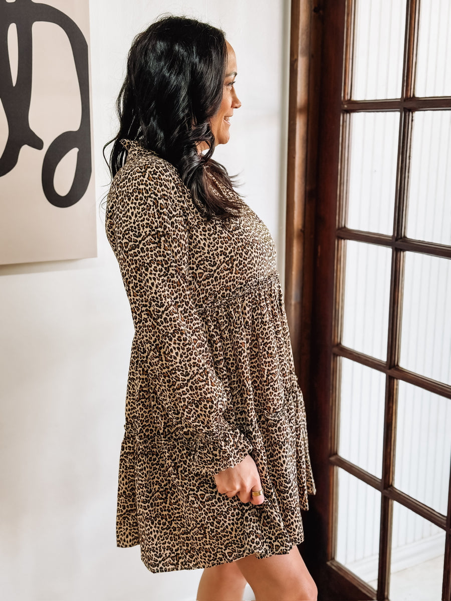 Long sleeve v neck bell sleeve leopard print tiered mini dress.