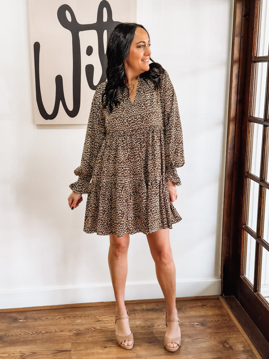 Long sleeve v neck bell sleeve leopard print tiered mini dress.