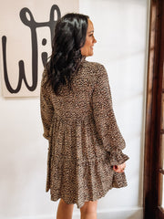 Long sleeve v neck bell sleeve leopard print tiered mini dress.