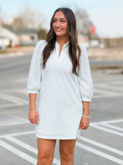 Mint pinstripe 3/4 sleeve bow tie detail mini dress with subtle v neckline.