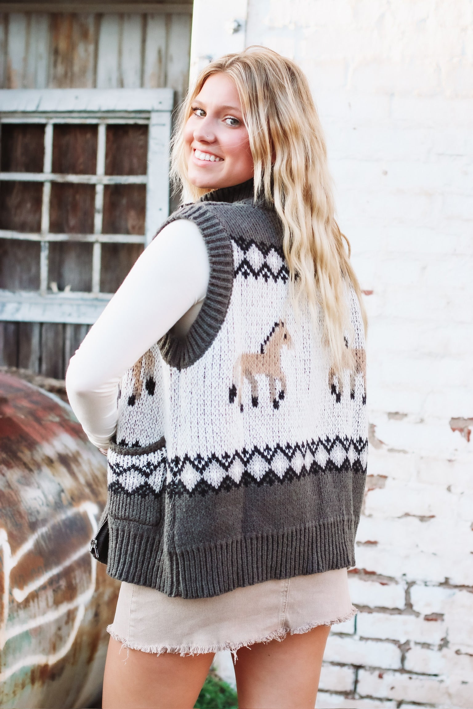 Mock neck zip up sweater vest with charcoal fairisle and horse graphic.