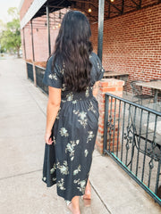 Short sleeve navy floral midi dress with v neck and zip front closure and smocked waist.