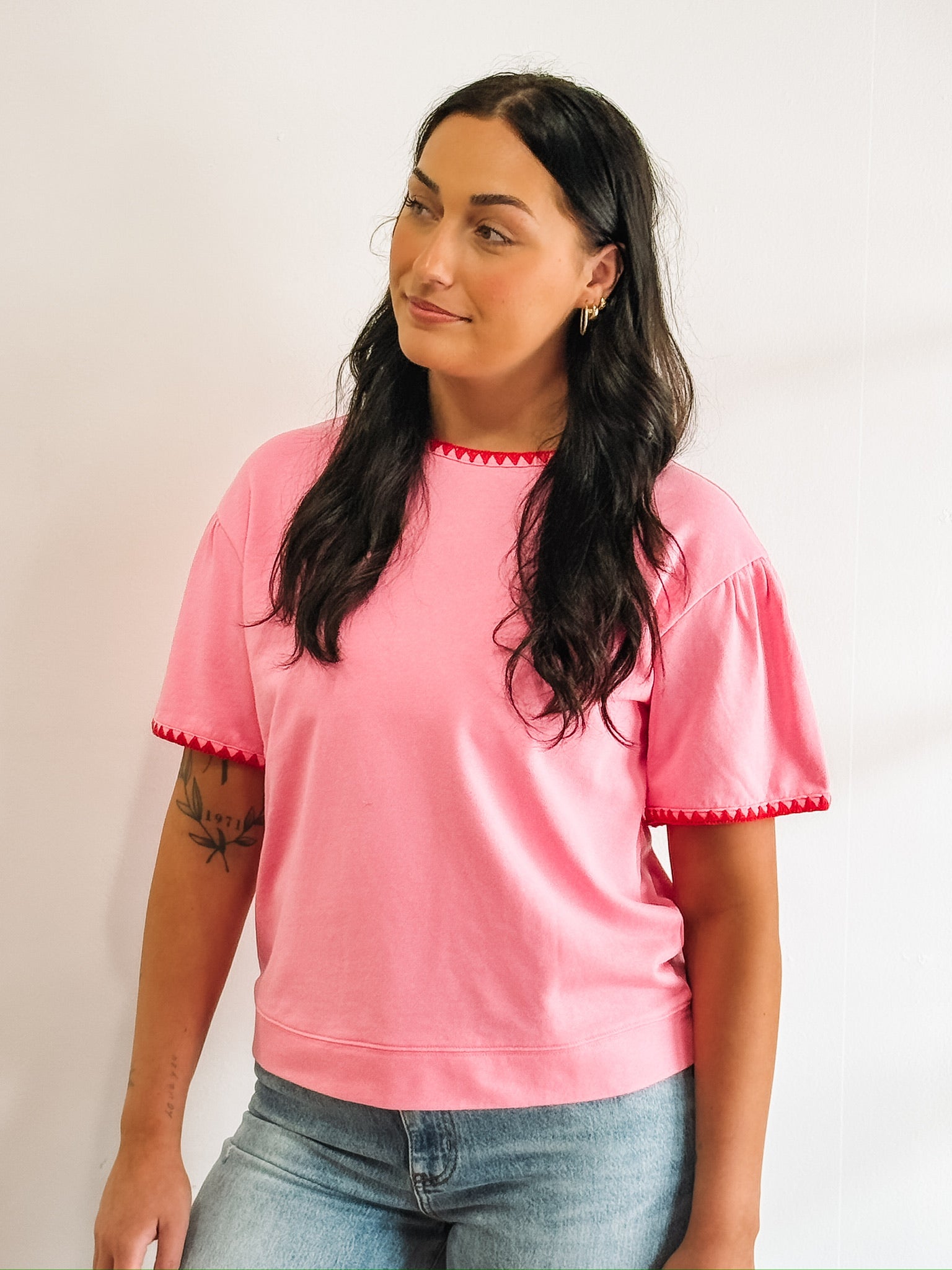 Pink short sleeve tee with red triangle piping.