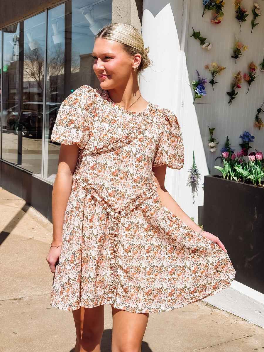 Pink and peach hued floral dress with ruffle detail