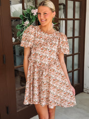 Pink and peach hued floral dress with ruffle detail