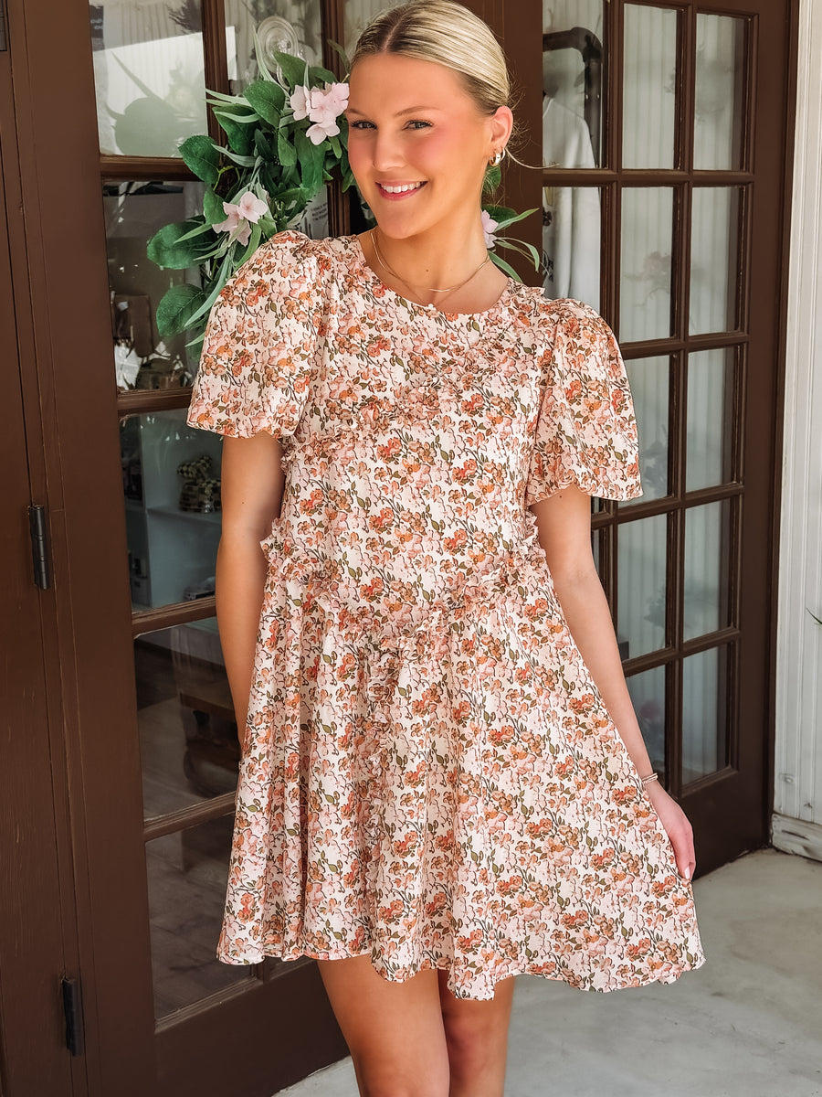 Pink and peach hued floral dress with ruffle detail